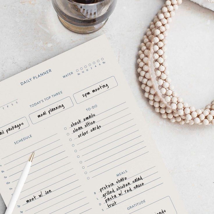 Minimal weekly wellness schedule with planner, water bottle, and workout essentials.